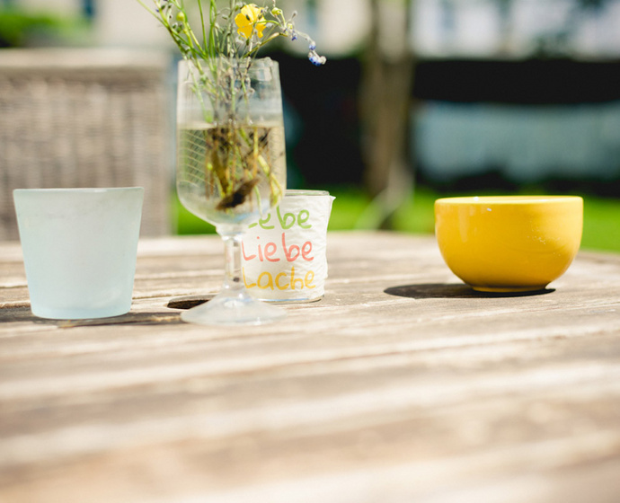 Table with candle and flowers