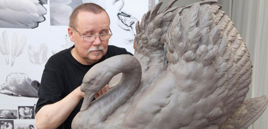 Man working on porcelain swan